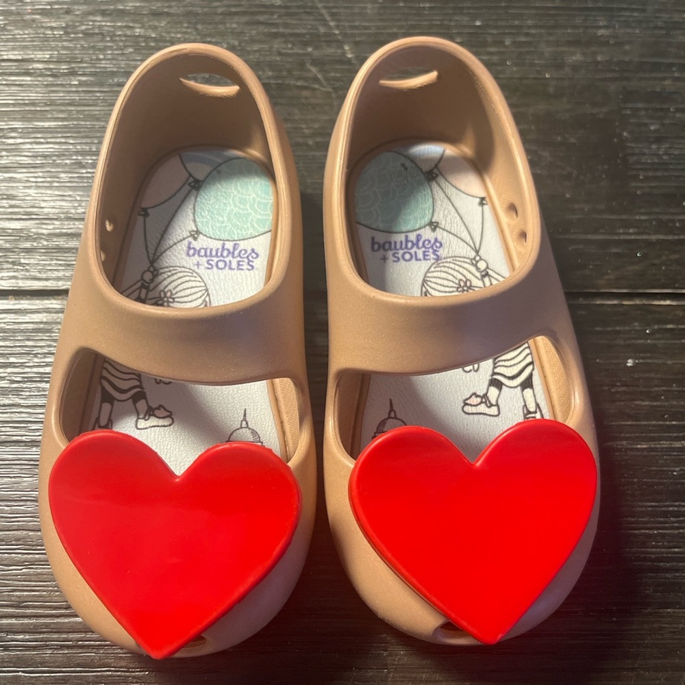 Baubles + Soles toddler shoes with removable red heart charms.
Size 6 US